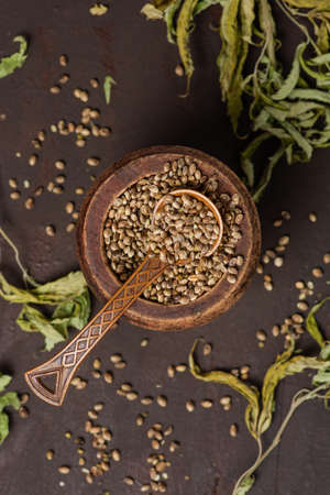 A lot of medicinal marijuana seeds in a bowlの写真素材