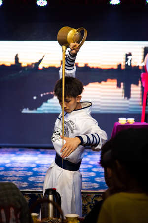 Chengdu, China - July 26, 2019: Artisan tea ceremony performance show at Chinese opera house in Chengdu, Sichuan province of Chinaのeditorial素材