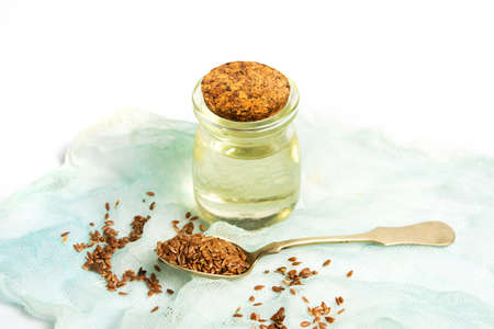 Linen flax seeds essential oil in a bottle