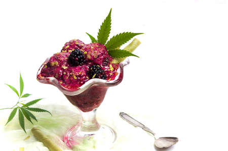 Blackberry fruit ice cream with marijuana in a cup isolatedの写真素材