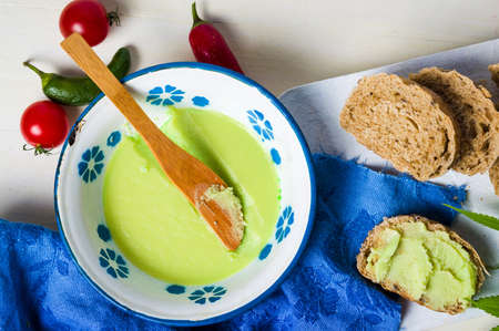 Butter with cannabis plant in a bowl top viewの写真素材