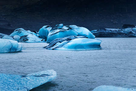 Icebergs floating at Solheimajokull Glacier near Vik in south Icelandの写真素材