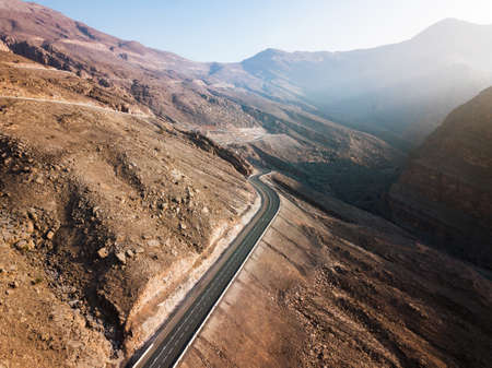 Desert road on the Jebel Jais mountain in the UAE aerial viewの写真素材