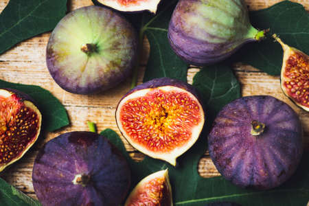 Fresh figs slices on a wooden tableの写真素材