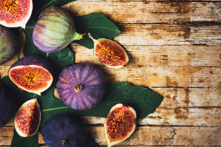 Fresh figs slices on a wooden tableの写真素材