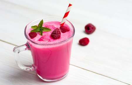 Home made raspberry smoothie in a decorated glass
