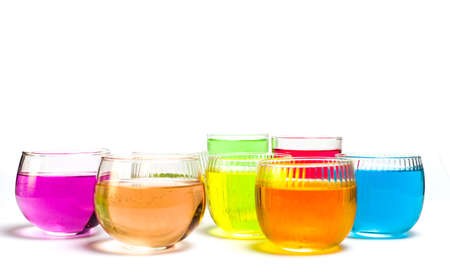 Colorful cocktail drinks in glasses isolated on whiteの写真素材