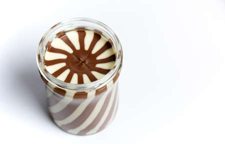 Sweet cream in the jar isolated in white