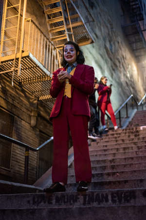 NEW YORK, USA,-NOVEMBER 31,2019: Random person impersonating the Joker and dancing at staircase in the Bronx, New Yorkのeditorial素材