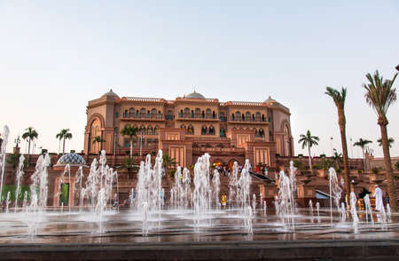 Abu Dhabi, United Arab Emirates - November 1, 2019: Emirates palace in Abu dhabi reflected on the ground level fountain at sunsetのeditorial素材