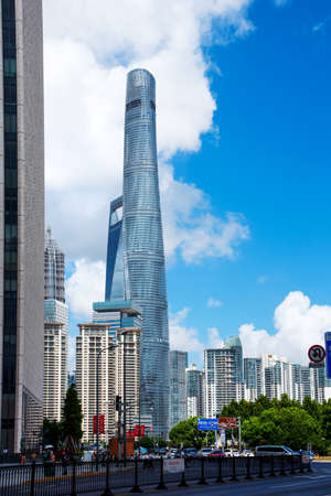 Shanghai, China - August 8, 2019: Shanghai Tower rising above modern downtown area with skyscrapers...