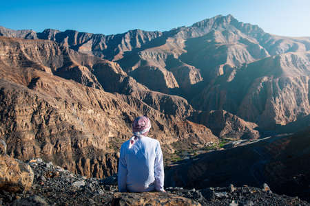 Arab man enjoying Jais desert mountain view in Ras al Khaimah UAEの写真素材