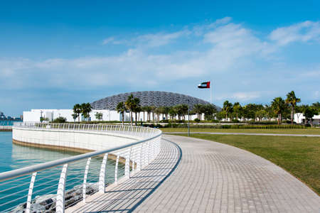 Abu Dhabi, United Arab Emirates - December 20, 2019: Louvre museum in Abu Dhabi exterior and entrance with characteristic architecture on a sunny dayのeditorial素材