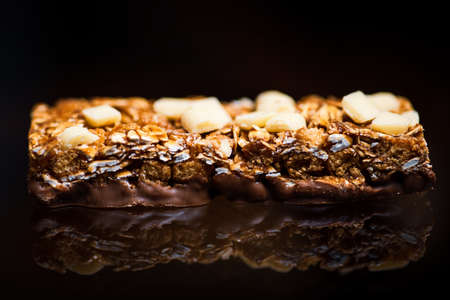 Protein granola bars with nuts on a table closeup
