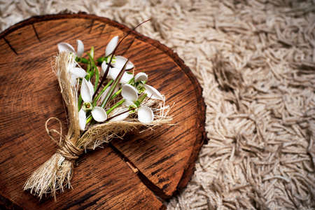 Snowdrop flowers bouquet on rustic background top viewの写真素材