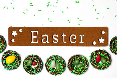 Easter background card with chocolate candy on white
