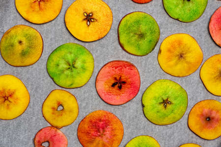 Dehydrated apple chips homemade organic natural snack flat layの写真素材
