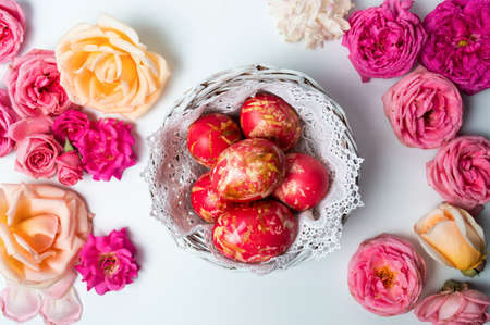 Easter eggs with roses in bloom top viewの写真素材