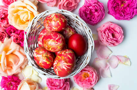 Easter eggs with roses in bloom top viewの写真素材