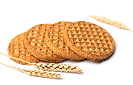 Integral wheat cookie biscuits isolated on white backgroundの写真素材
