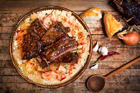 Dish of cabbage and smoked meat in rustic bowl top viewの写真素材