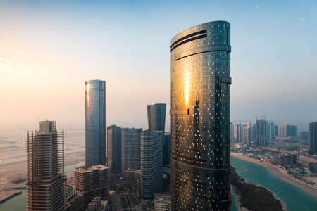 Skyline of Al Reem Island in Abu Dhabi, United Arab Emirates at sunset