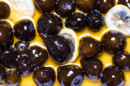 Sweet boiled figs with lemon background pattern top view