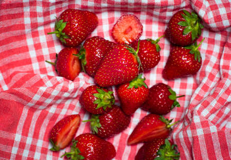 Bunch of strawberries on a kitchen cloth closeup. Cooking abstractの写真素材