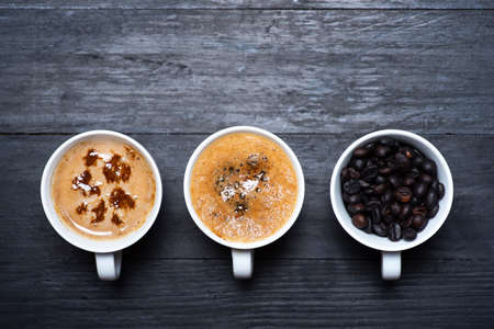 Coffee time. Cup of coffee, roasted beans top view with copy spaceの写真素材