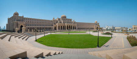 Sharjah, United Arab Emirates - March 24, 2021:Sharjah Municipality main office resembling parliament building characterised by islamic architecture in Sharjah emirate downtown in the United Arab Emirates on a sunny dayのeditorial素材