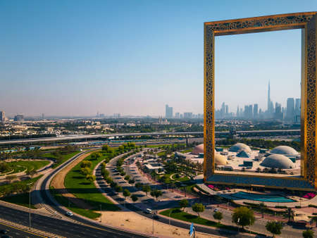 Dubai, United Arab Emirates, April 19, 2021: Dubai skyline seen through Dubai Frame building with Zabeel park and Dubai skyline aerial cityscape view of the Emirateのeditorial素材