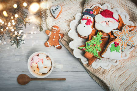 Christmas cookies on a table with winter holidays festive decorations and symbols top view flat lay arrangementの写真素材