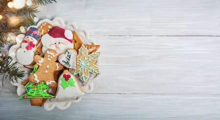 Christmas cookies on a table with winter holidays festive decorations and symbols top view flat lay arrangementの写真素材