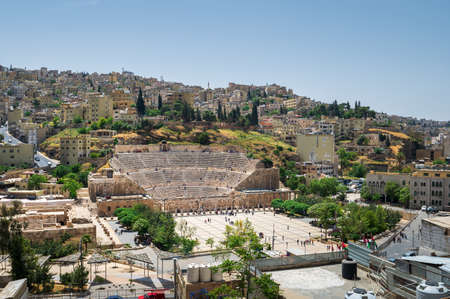 Amman downtown skyline in Jordan dominated by ancient Roman theater structure among residential houses in the old city centerのeditorial素材
