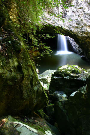 Waterfall in Cave - Natural Bridge, Queensland, Australiaの写真素材