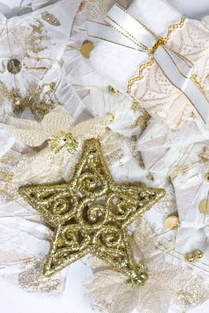 close up of decorative gold christmas ornaments against backgroundの写真素材