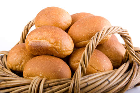 fresh baked bread rolls / buns in cane basket