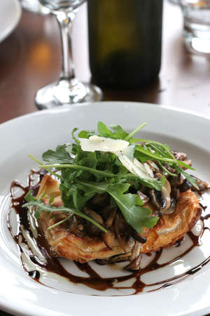 close up of gourmet mushroom tartlet with salad greensの写真素材