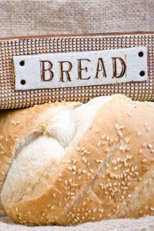 close up of fresh baked white loaf of bread with sesame seedsの写真素材