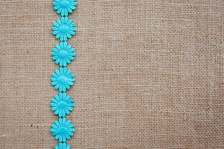 Background - burlap hessian with daisy chain patternの写真素材