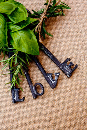 Love Keys with herbs on burlap backgroundの写真素材