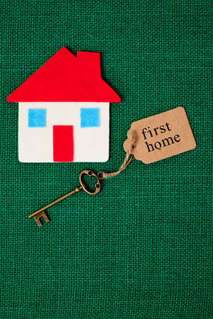 House with First Home key on green backgroundの写真素材