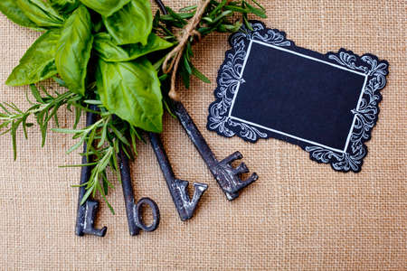 Love Keys with herbs on burlap backgroundの写真素材