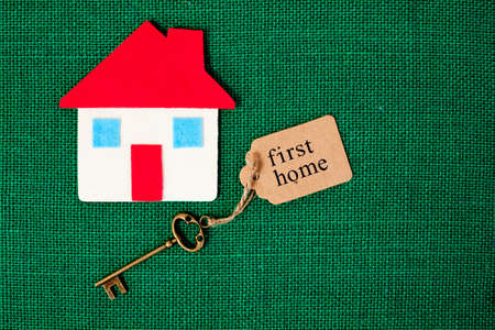 House with First Home key on green backgroundの写真素材