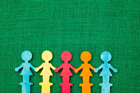 Female / women wooden figures on burlap background