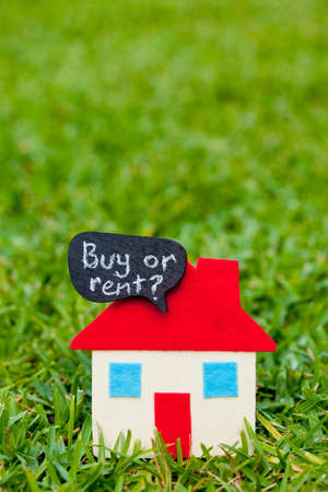 House - Home - Buy or Rent - on grass backgroundの写真素材