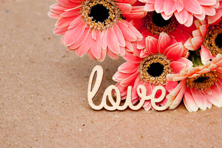 Love with pink flowers with natural paper backgroundの写真素材