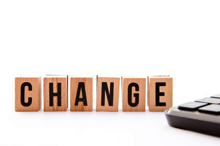 Change - wooden block letters with keyboard on white background