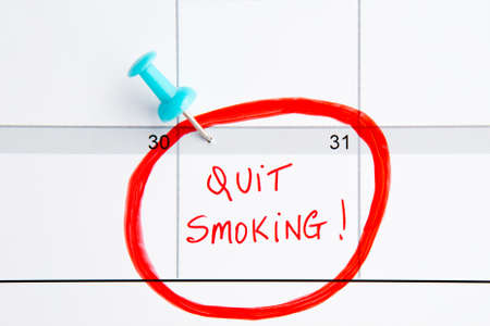 Quit Smoking Calendar - with handwriting in red with blue push pinの写真素材
