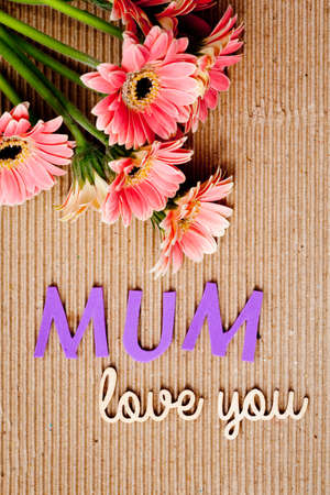 Mother's Day message with flowers on corrugated cardboard background - Mumの写真素材